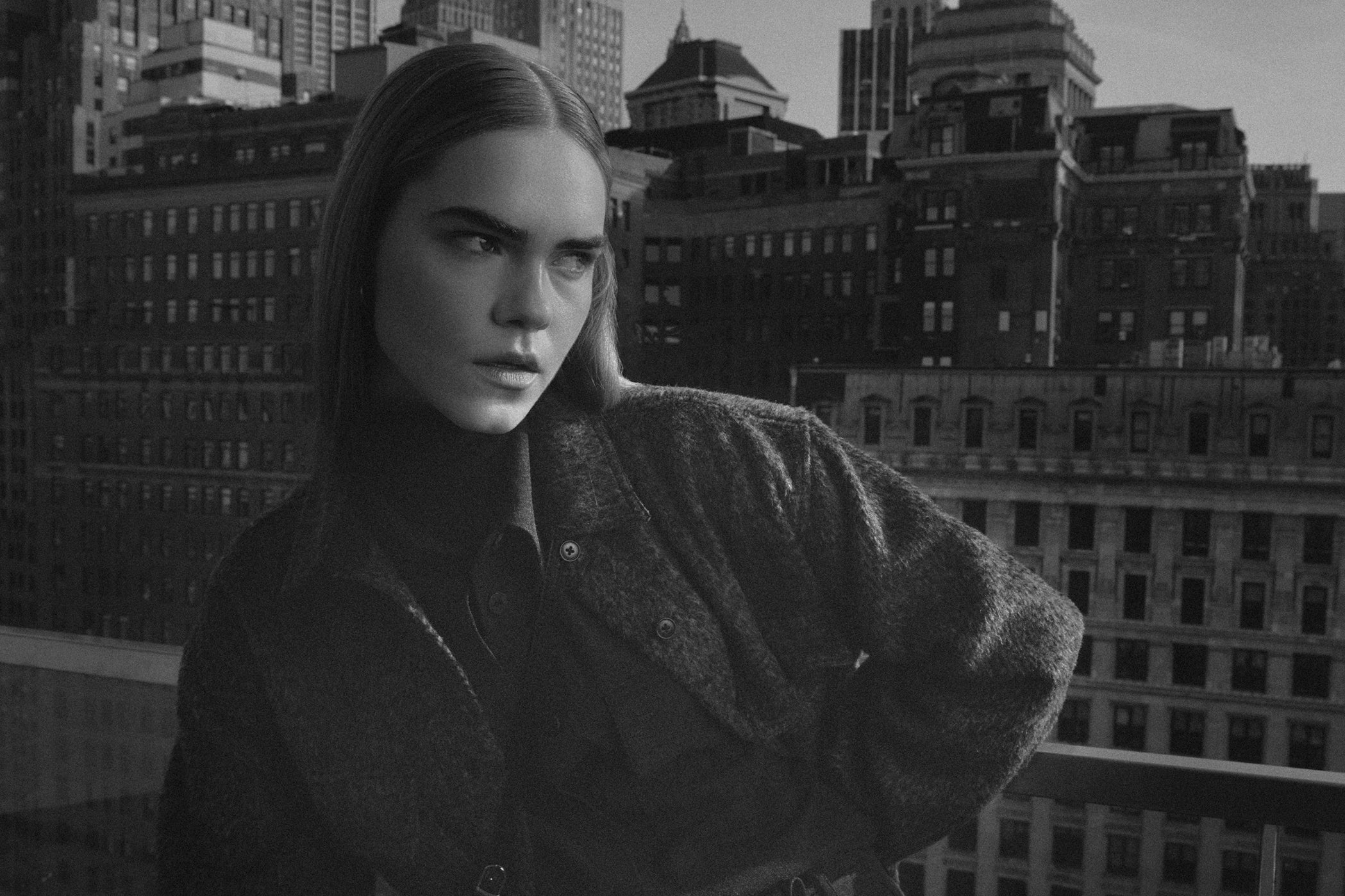 Man and woman wearing earth-toned outfits from Minimum in New York.