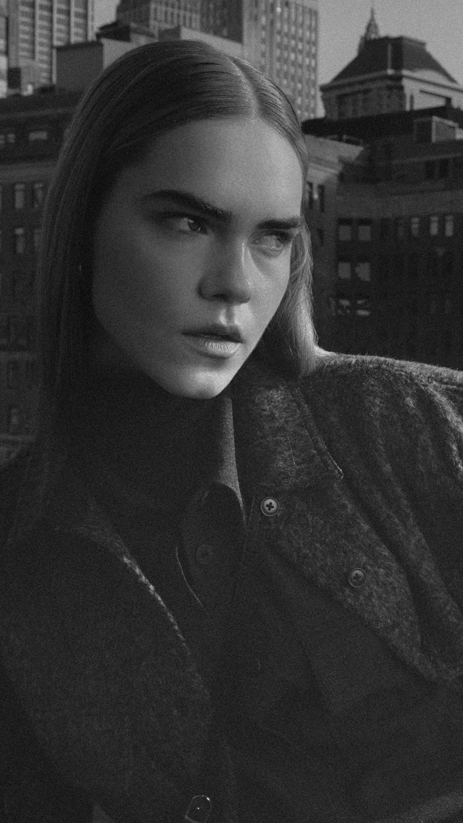 Man and woman wearing earth-toned outfits from Minimum in New York.